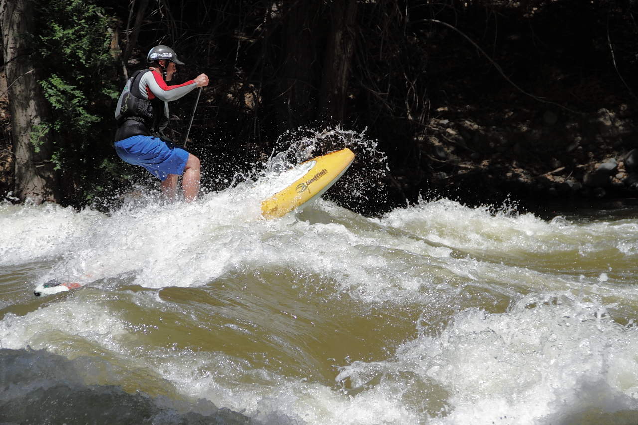 stand up paddle boarding on a river