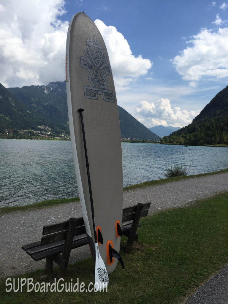 Paddle Board in front of a lake with mountains