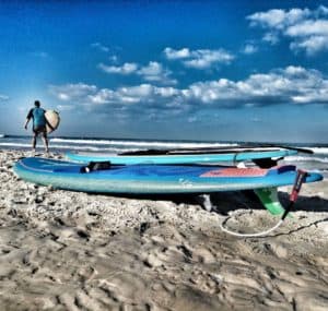 A man, his boards, and his passion for the waves. Just a picturesque moment, nothing else to say.