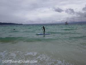My instructor demonstrating the basics of SUP on choppy waters