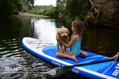 Kid And Dog On Inflatable SUP