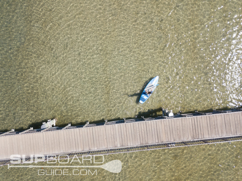 Paddling SUP under bridge