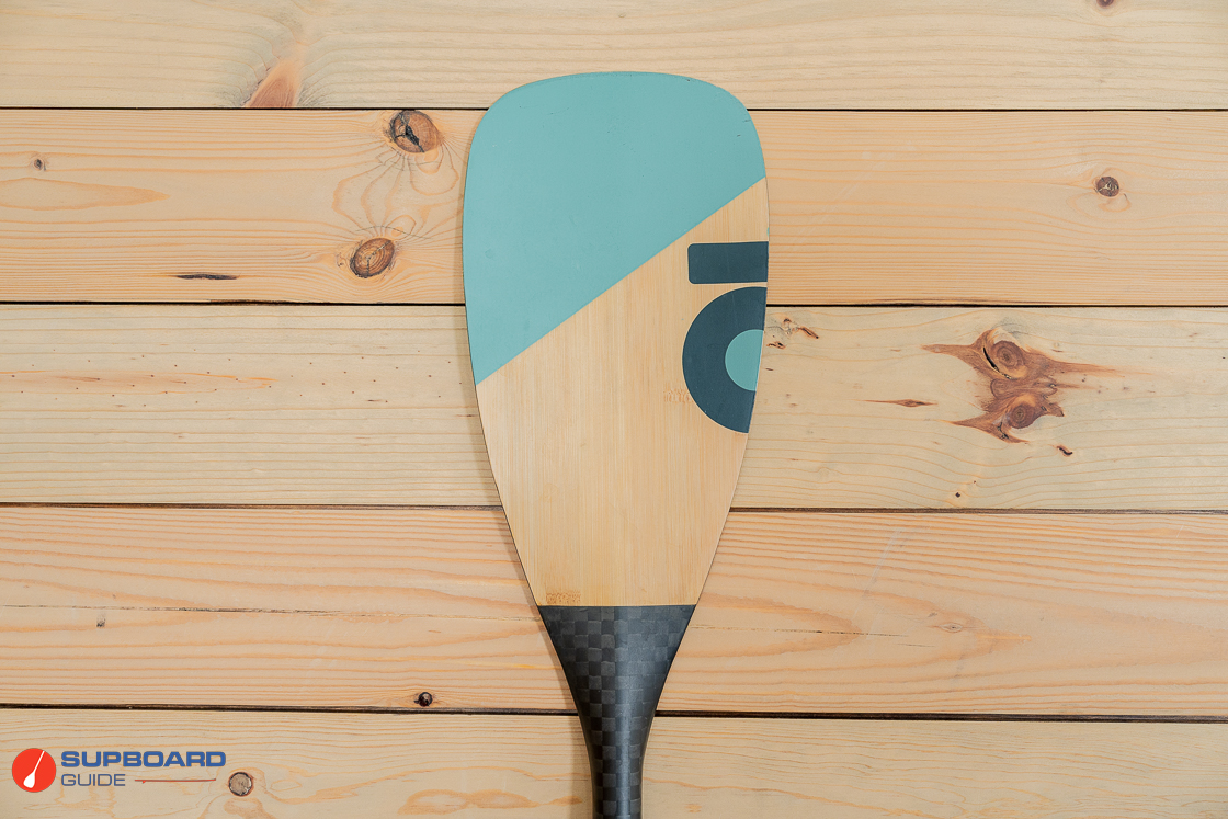 The blade of the Honu Evo 3 Piece Bamboo Carbon Paddle features a modern high aspect plan shape